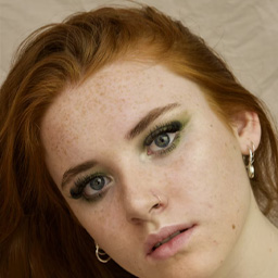 Before circular cropping: tech startup founder at conference with busy networking event background